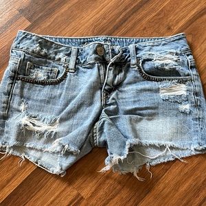 American Eagle - light wash jean shirts - size 4 - gently worn